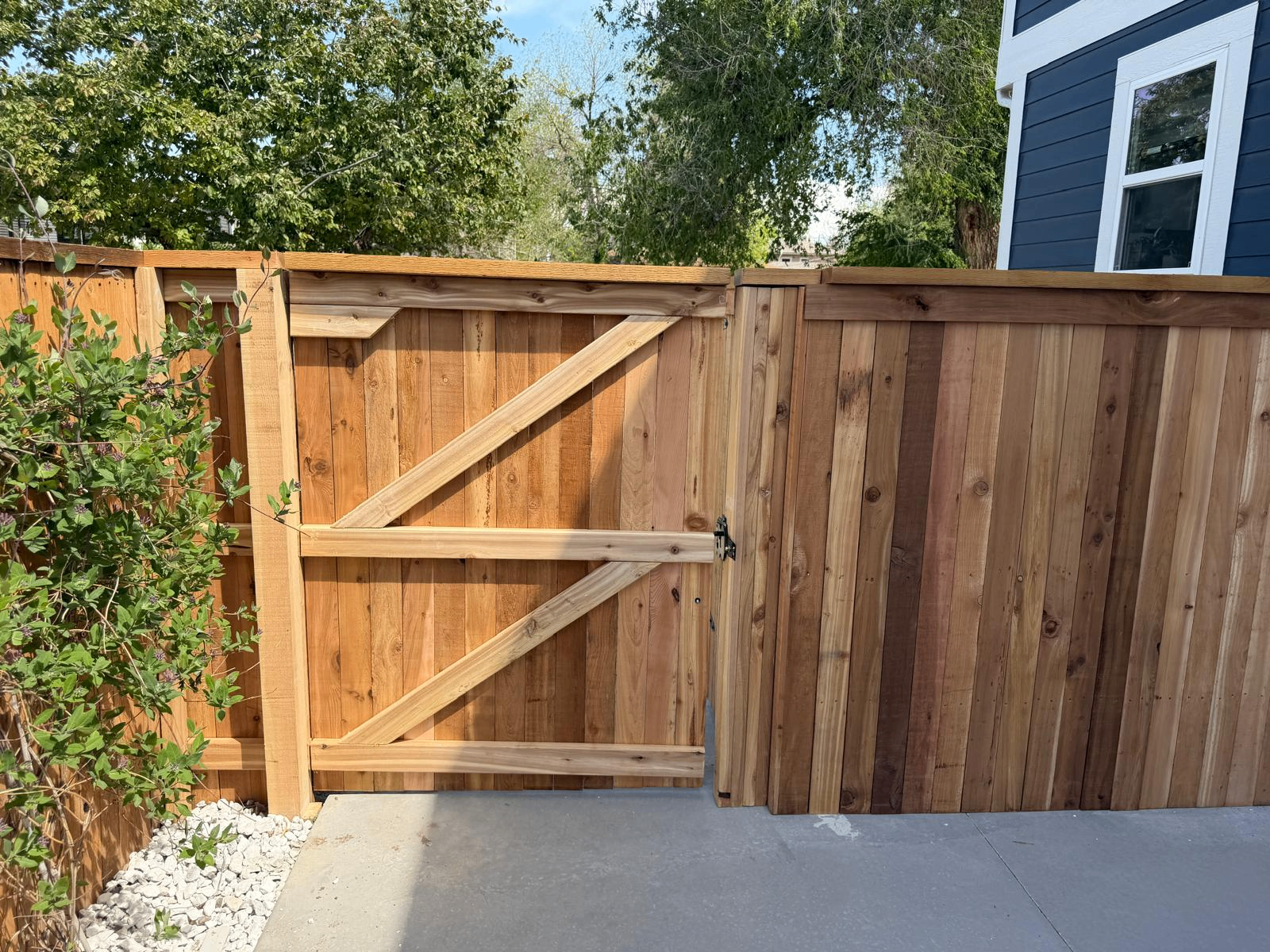 Custom cedar gate and privacy fence installation with clean joinery and premium finish